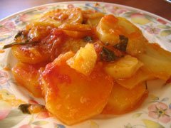 Stewed potatoes with tomato sauce