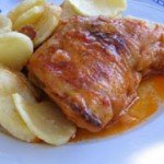 Rooster in wine and tomato sauce